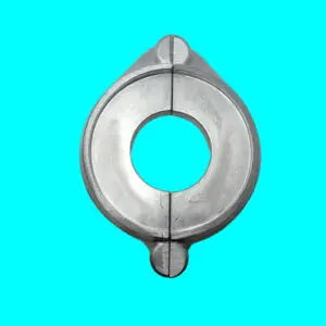 Metallic circular object on turquoise background