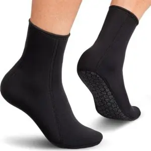 Black neoprene socks on feet